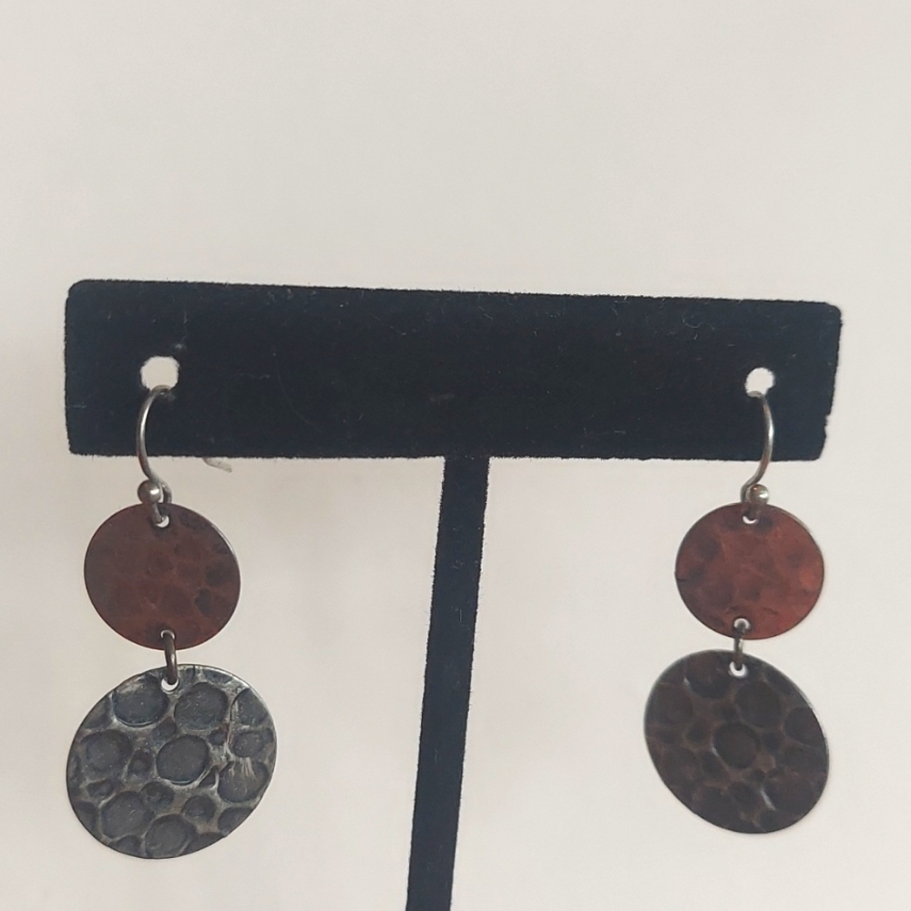 Hammered 2 tone earrings with shepard hooks .